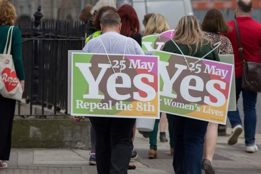 Activists from the "Yes" campaign, urging people to vote 'yes' in the referendum to repeal the eighth amendment of the Irish constitution, canvas voeters in Dublin on May 24, 2018. Ireland will hold a referendum on May 25 on whether to alter its constitution to legalise abortion. The Eighth Amendment of the Irish constitution recognises the equal right to life of the unborn and the mother. Abortion is illegal unless there is a real and substantial risk to the life of the mother, and a woman convicted of having an illegal termination faces 14 years imprisonment. / AFP PHOTO / BARRY CRONINBARRY CRONIN/AFP/Getty Images ** OUTS - ELSENT, FPG, CM - OUTS * NM, PH, VA if sourced by CT, LA or MoD **