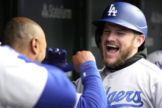 Los Angeles Dodgers' Max Muncy, right, celebrates with Mookie Betts after hitting a two-run home run during the sixth inning of a baseball game against the Chicago Cubs in Chicago, Sunday, April 23, 2023. (AP Photo/Nam Y. Huh)
