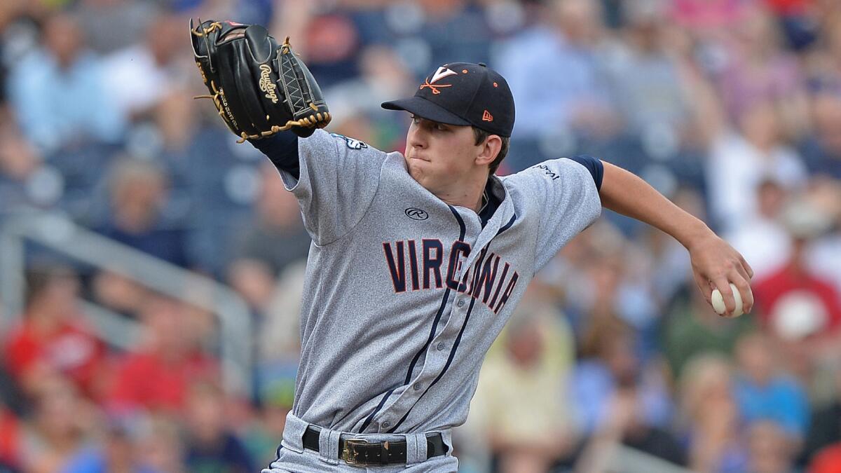 Virginia starter Brandon Waddell delivers a pitch during the first inning of his complete-game effort in a 7-2 win over Vanderbilt in Game 2 of the College World Series on Tuesday.