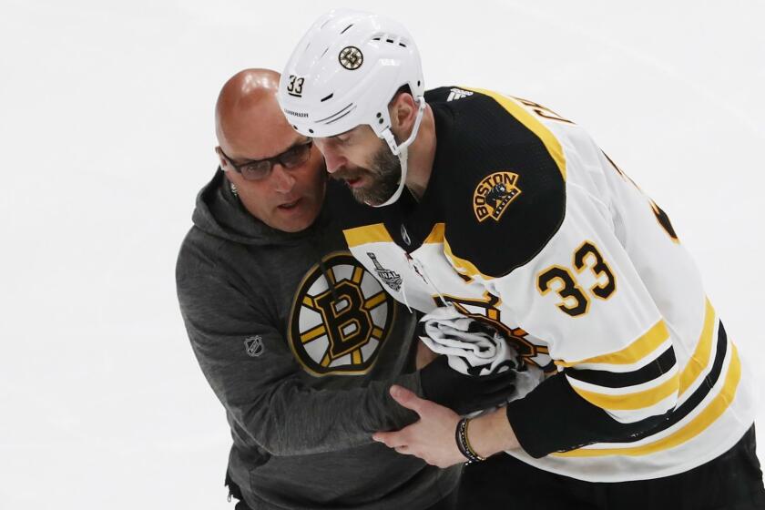 ST LOUIS, MISSOURI - JUNE 03: Zdeno Chara #33 of the Boston Bruins is attended to after being injured during the game against the St. Louis Blues in Game Four of the 2019 NHL Stanley Cup Final at Enterprise Center on June 03, 2019 in St Louis, Missouri. (Photo by Jamie Squire/Getty Images) ** OUTS - ELSENT, FPG, CM - OUTS * NM, PH, VA if sourced by CT, LA or MoD **