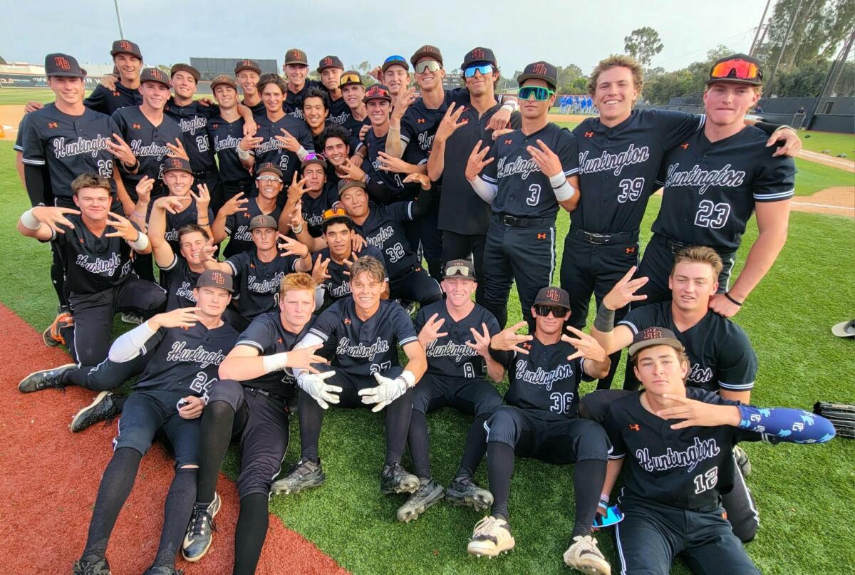 Huntington Beach players are all smiles after their 3-2 win over Santa Margarita in eight innings.