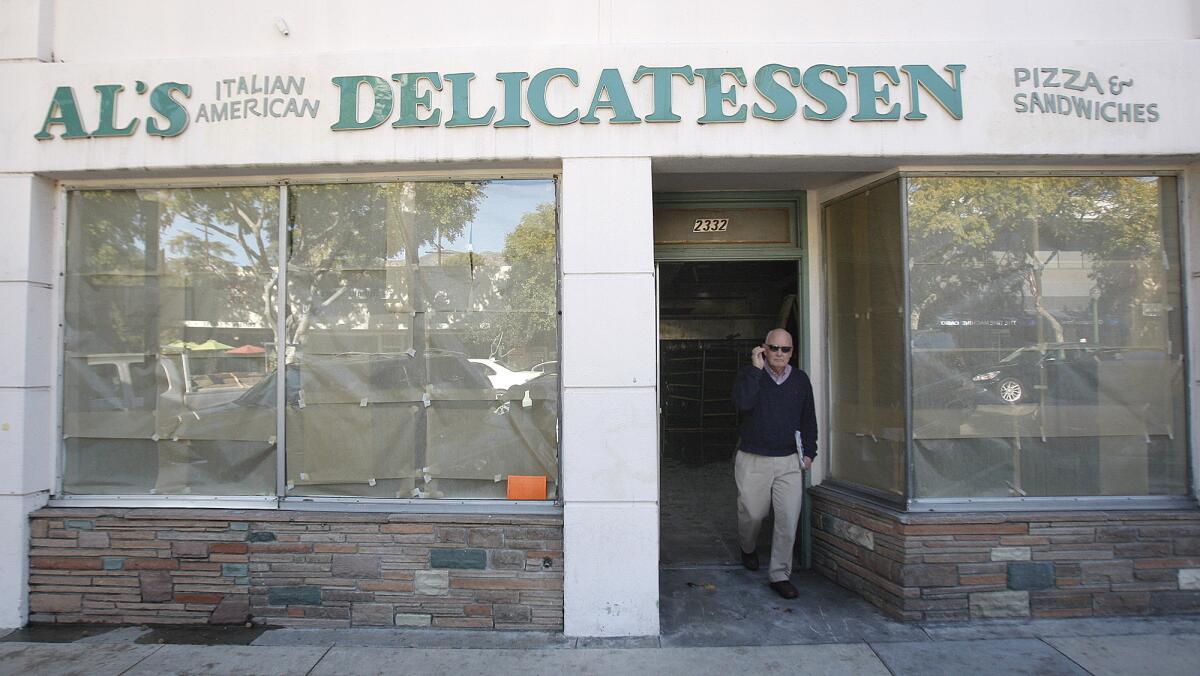 Crescenta Valley Chamber of Commerce President Steve Pierce walks out of the closed Al's Italian American Delicatessen in Montrose on Monday, Jan. 13, 2014. Pierce was checking out the progress of the construction for the restaurant that will re-occupy the vacancy.