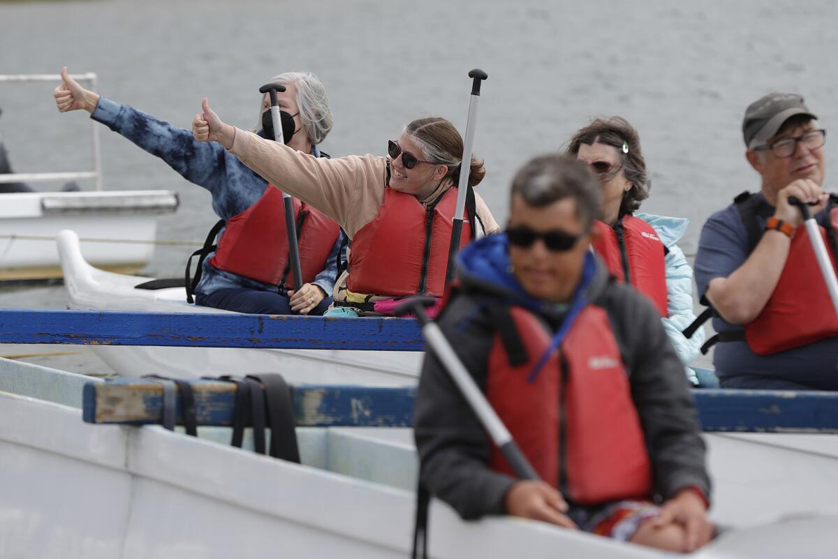 Boaters give the thumbs up to launch at the Newport Aquatics Center in Newport Beach on Thursday.