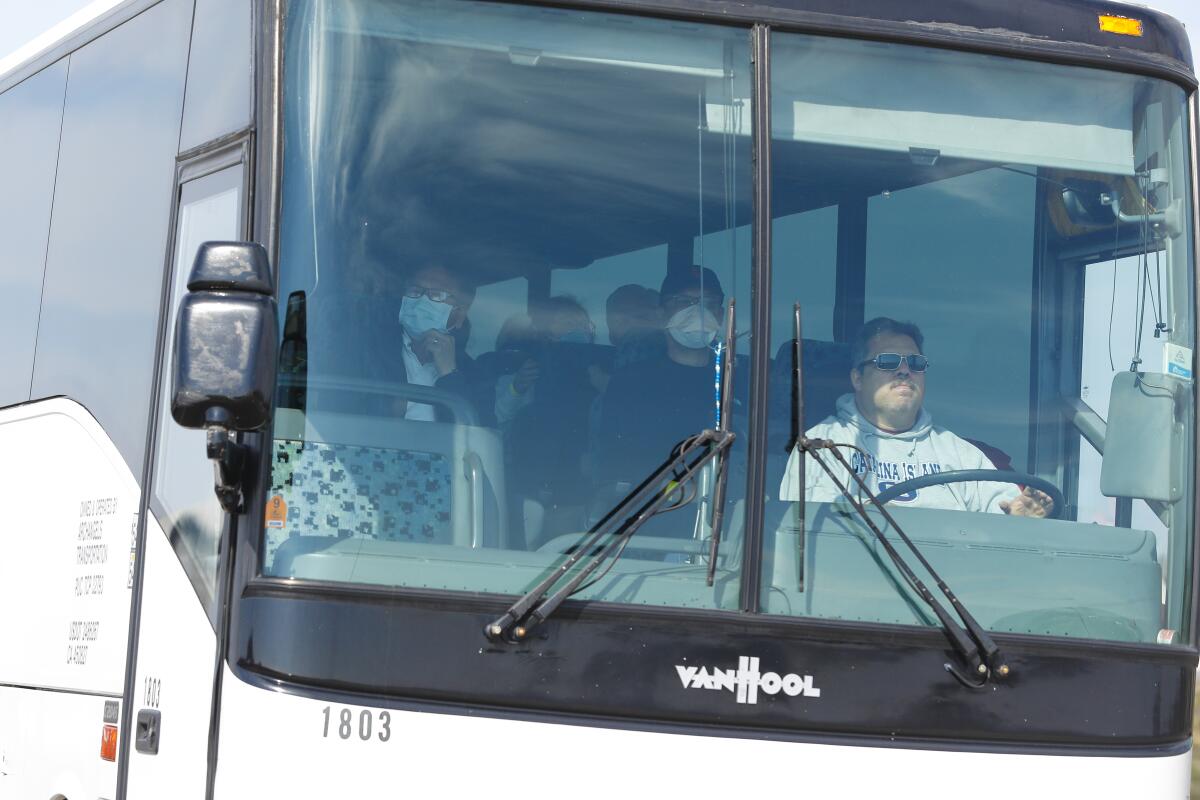 The first bus with coronavirus evacuees leaves Miramar.