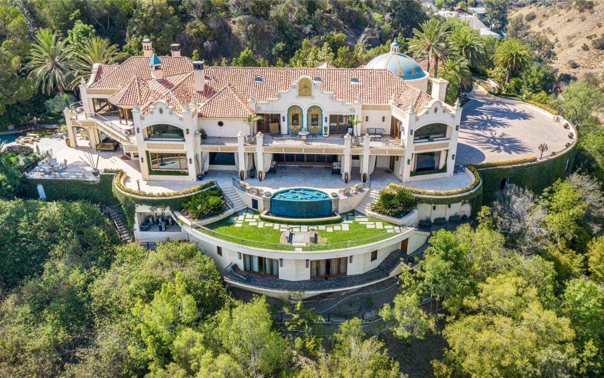 The 21,000-square-foot mansion comes with a 75-yard swimming pool, 35-foot water slide and a 16-car subterranean garage.