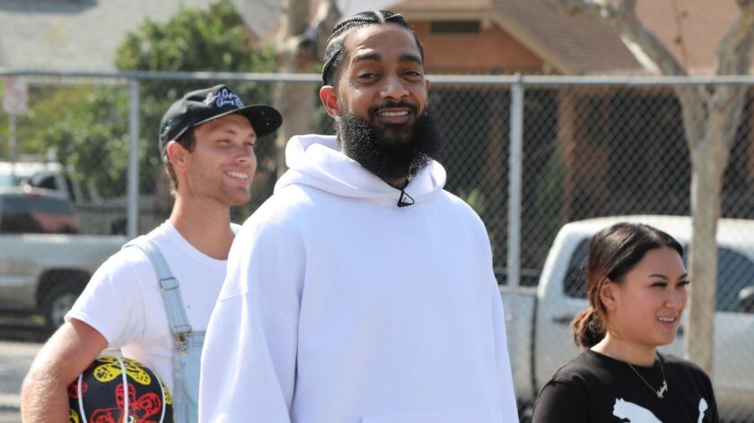 Nipsey Hussle at a basketball court refurbishment event in 2018.