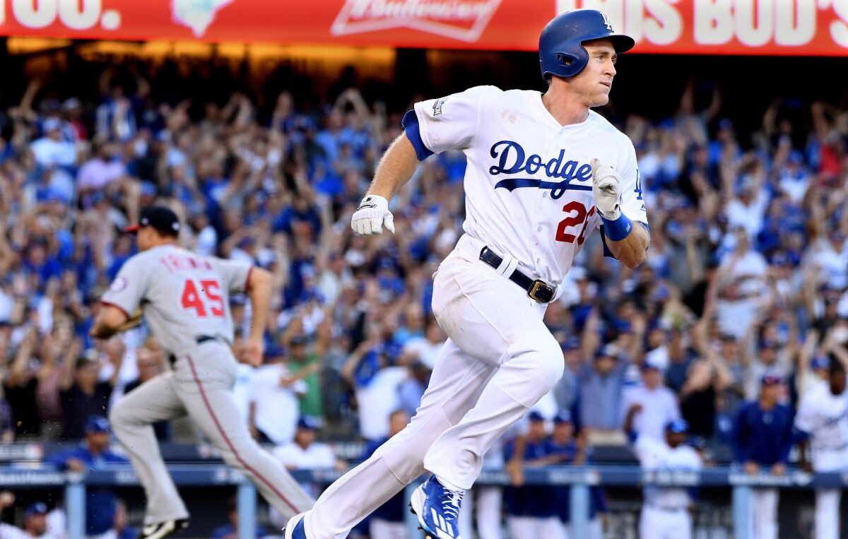 Dodgers second baseman Chase Utley heads to first base after connecting on the game-winning hit in the eighth inning of Game 4 of the National League division series on Oct. 11, 2016.