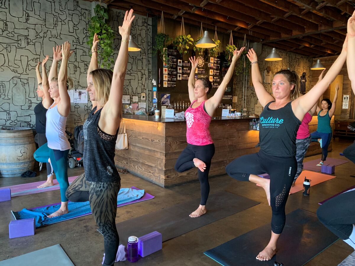 Hoppy Yoga instructors lead 75-minute sessions at various San Diego breweries.