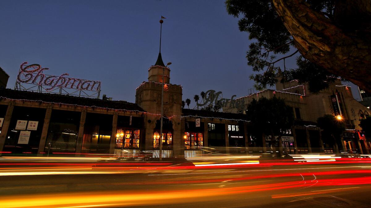 The Chapman Market, a 1928 landmark, is adorned with holiday lights year round, and has seen a resurgence since the Los Angeles riots stalled area businesses in the early 1990s.