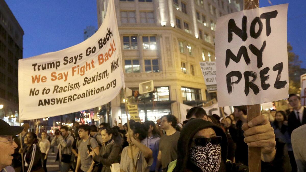 Protesters march in opposition of Donald Trump's presidential election victory in San Francisco.