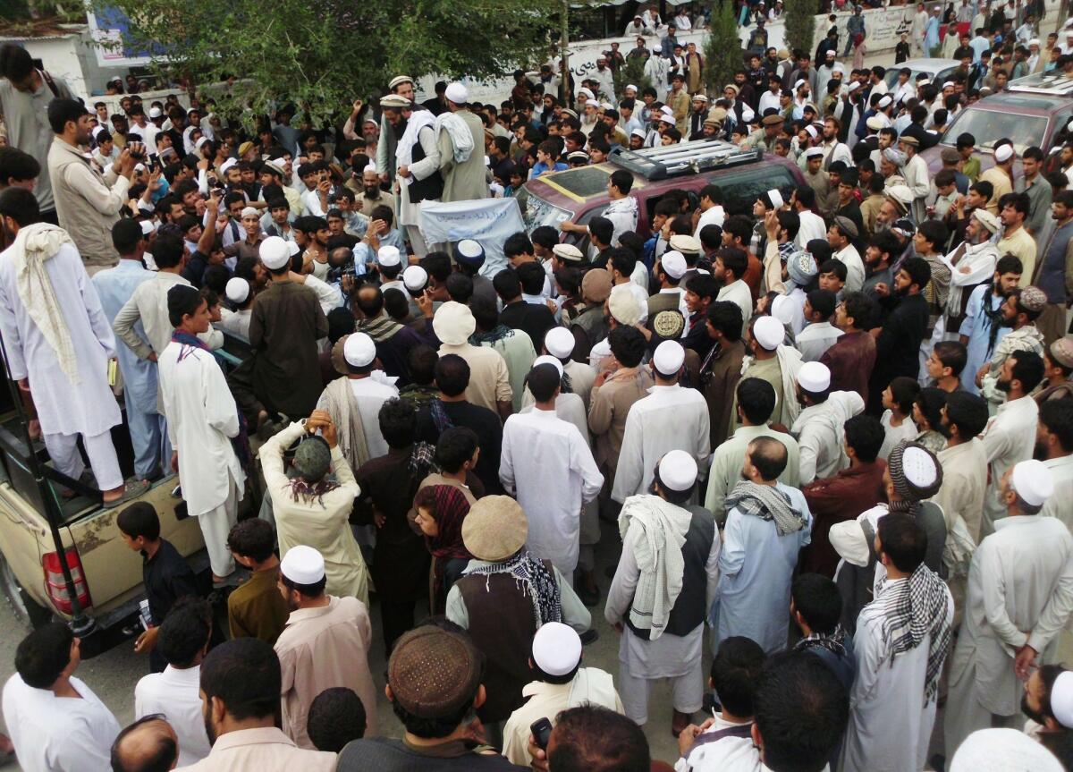 Afghan residents gather on Sept. 16, 2012, for an anti-NATO protest in Mihtarlam, Laghman province. The families of thousands of civilians killed by U.S. forces in Afghanistan have been left without justice or compensation, according to an Amnesty International report.