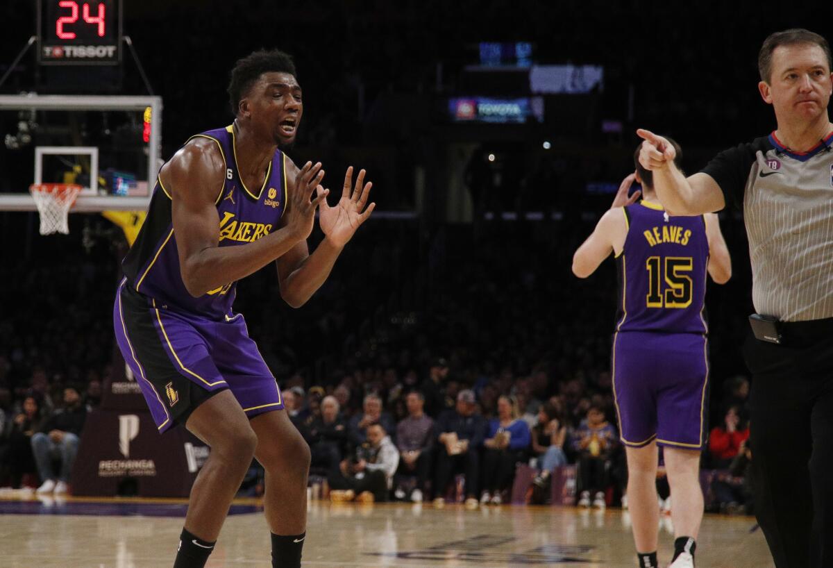 Lakers center Thomas Bryant pleads his case to an official after being called for goaltending against the Hornets.