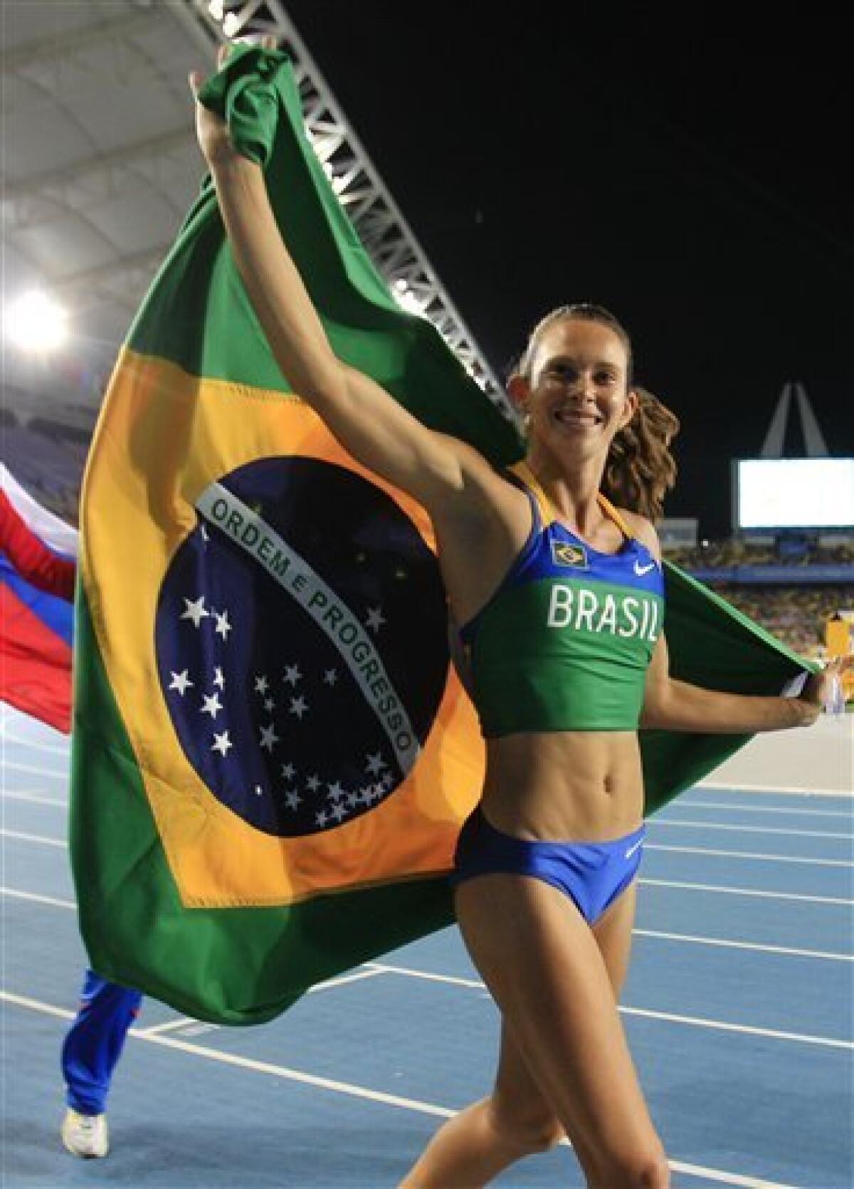 Brazil's Fabiana Murer celebrates winning gold in the Women's Pole Vault final at the World Athletics Championships in Daegu, South Korea, Tuesday, Aug. 30, 2011. (AP Photo/Lee Jin-man)