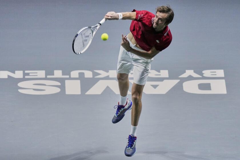Russian Tennis Federation's Daniil Medvedev returns the ball to Sweden's Mikael Ymer during a Davis Cup quarter final match between Russian Tennis Federation and Sweden at the Madrid Arena stadium in Madrid, Spain, Thursday, Dec. 2, 2021. (AP Photo/Bernat Armangue)