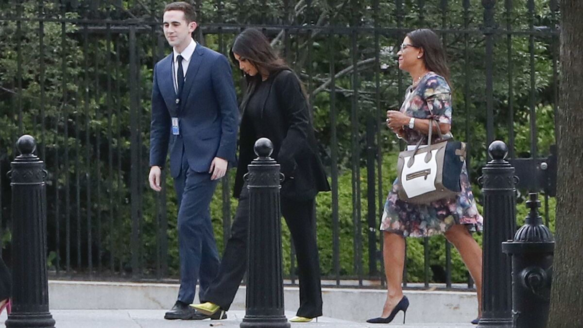 Kim Kardashian West, center, arrives at the White House to meet with President Trump on May 30.