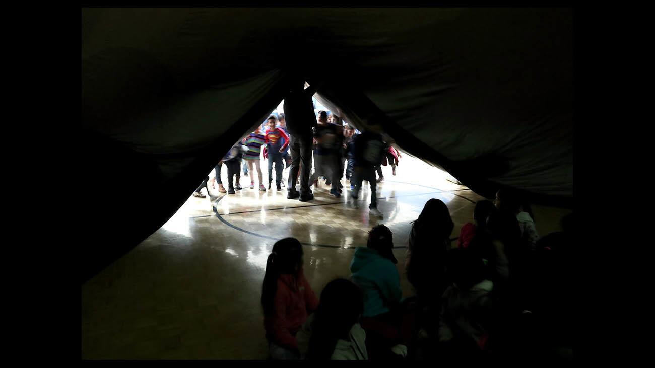 Photo Gallery: Oak View Elementary students view sky under mobile planetarium