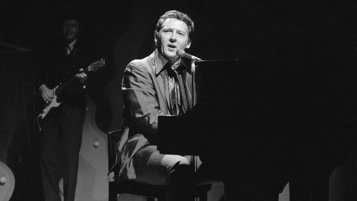 Jerry Lee Lewis plays the piano and sings as he appears on the CBS variety program "The Ed Sullivan Show."