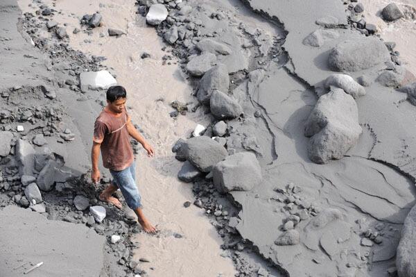 The Lamat River is saturated with ash following the eruption