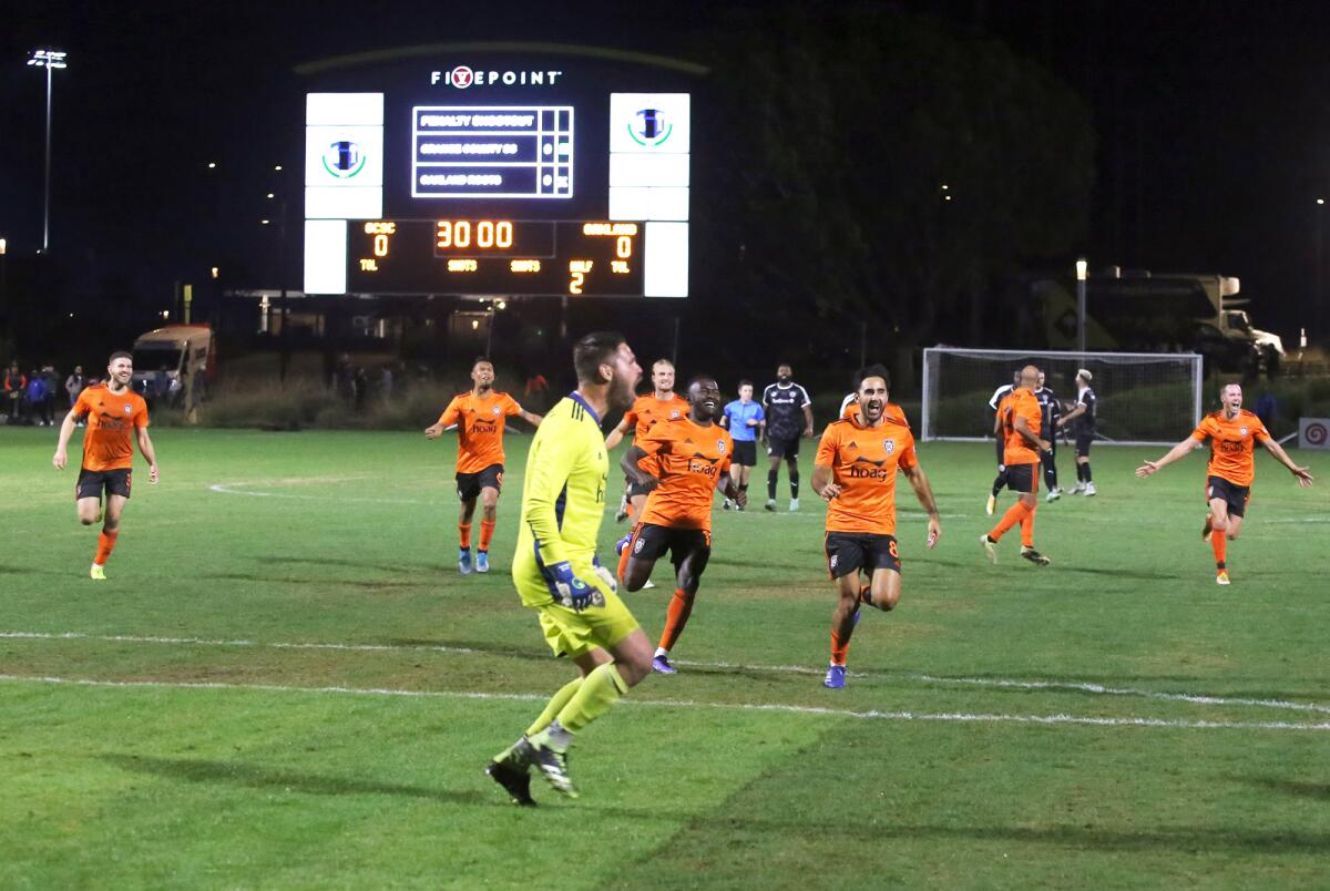 Orange County Soccer Club players celebrate after beating Oakland Roots SC on penalty kicks.