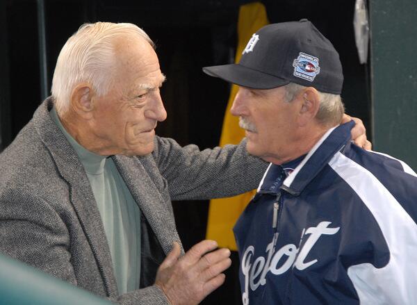 Former Detroit Tigers manager Sparky Anderson talks with then Tigers' manager Jim Leyland prior to Game Two of the 2006 World Series between the Tigers and the St. Louis Cardinals at Comerica Park in Detroit, Michigan.