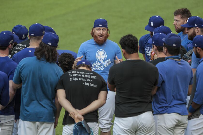 Arlington, Texas, Monday, October 5, 2020. Dodgers third baseman Justin Turner delivers talks with teammates moments after arriving for a workout at Globe Life Field the night before game one of the NLDS. (Robert Gauthier/ Los Angeles Times)