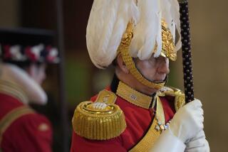 A member of The King's Body Guards of the Honourable Corps of Gentlemen at Arms performs guard duties around the coffin of Queen Elizabeth II, Lying in State inside Westminster Hall, at the Palace of Westminster, in London, Sunday, Sept. 18, 2022, ahead of her funeral on Monday. (AP Photo/Vadim Ghirda, pool)