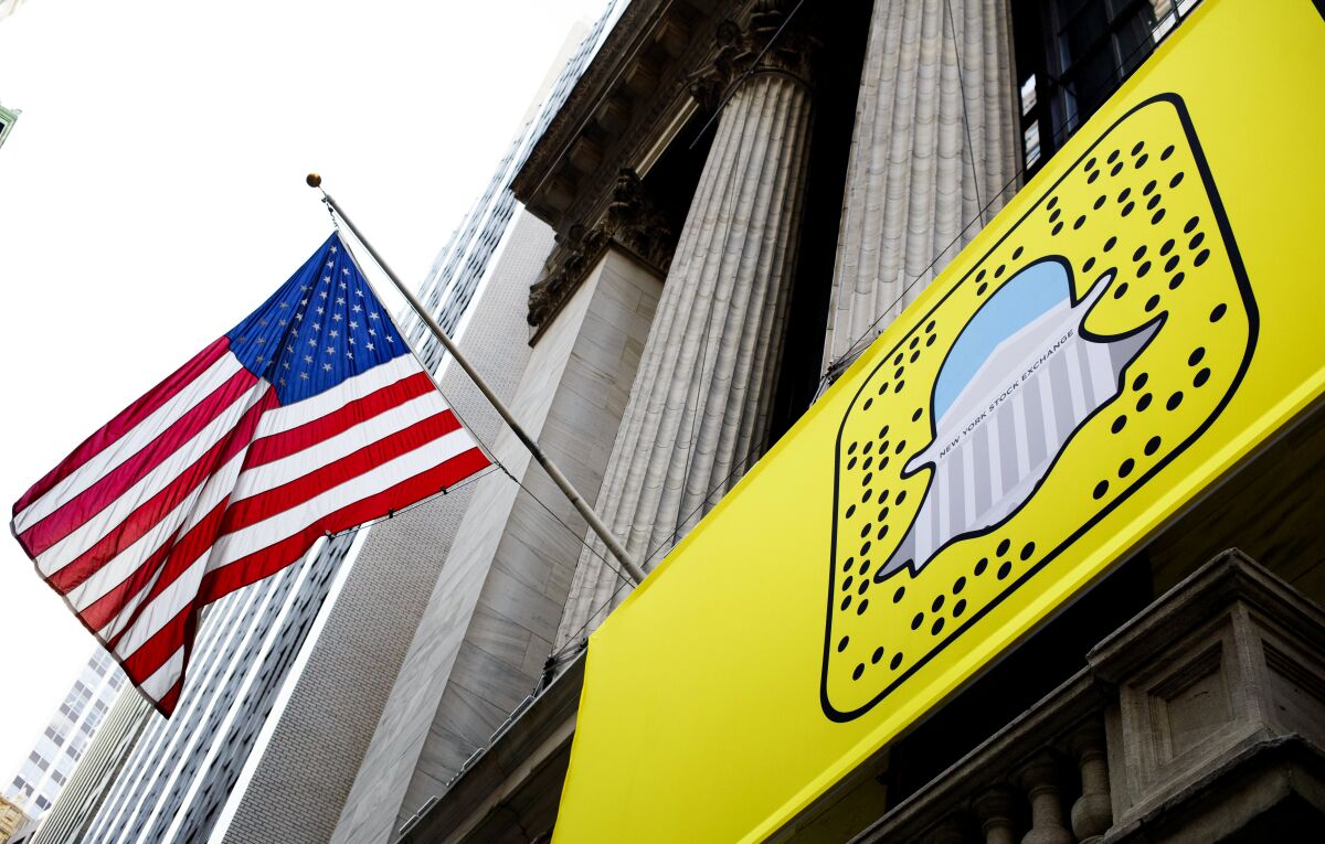 A logo for Snapchat hangs on the front of the New York Stock Exchange.