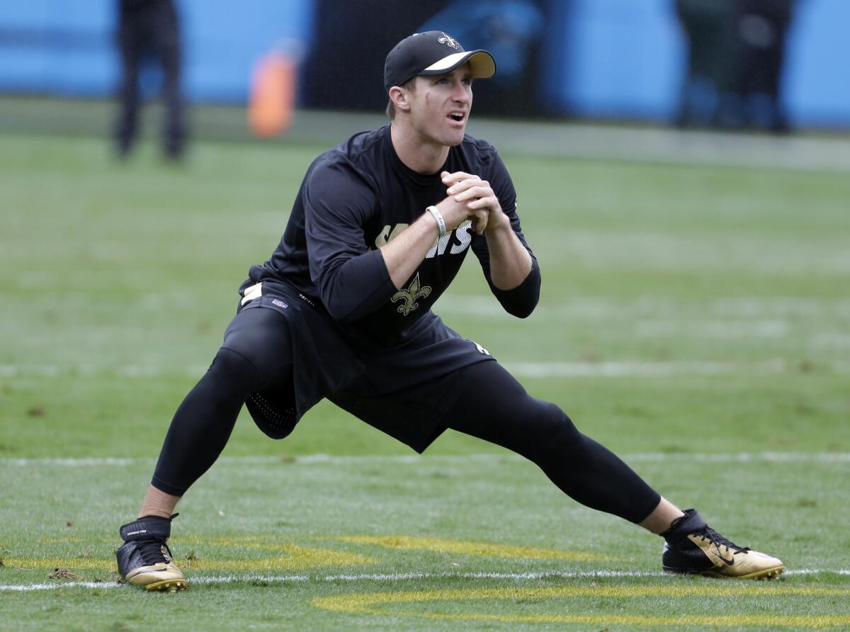 New Orleans Saints quarterback Drew Brees stretches before a game against the Carolina Panthers on Sept. 27.