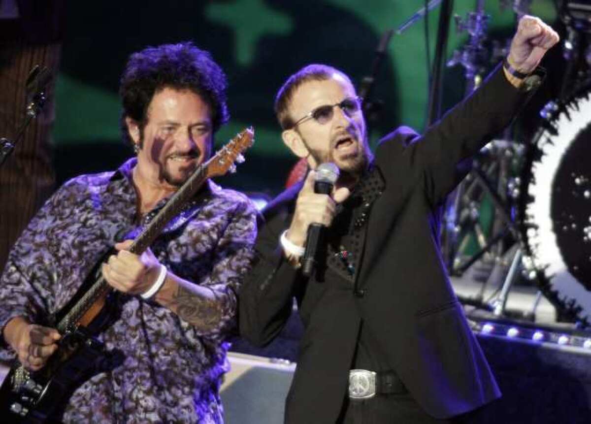 Ringo Starr, right, is joined by Toto guitarist Steve Lukather on Saturday at the Greek Theatre in Los Angeles.