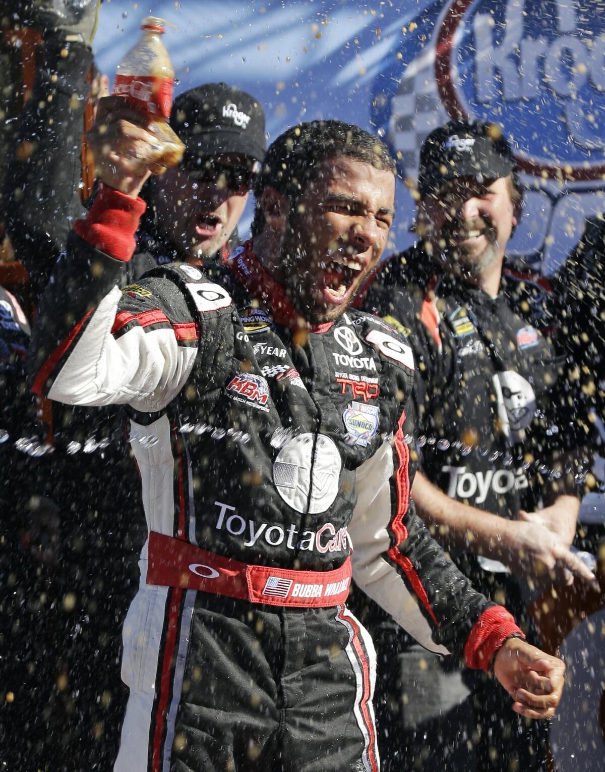 Darrell Wallace Jr. celebrates his NASCAR truck series win at Martinsville Speedway on Saturday.