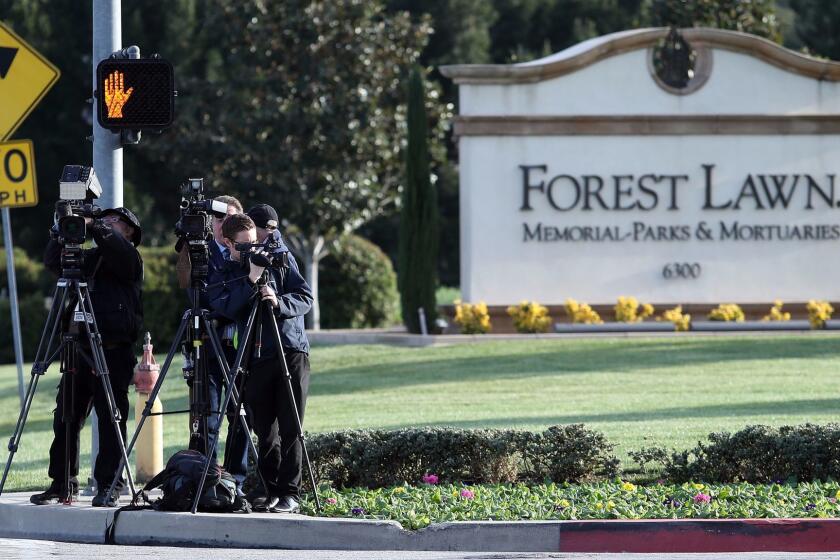 LOS ANGELES, CA - JANUARY 06: News crews waiting for the arrival of the funeral procession transporting Debbie Reynolds and Carrie Fisher to their Memorial and Funeral at Forest Lawn Cemetery on January 6, 2017 in Los Angeles, California. (Photo by Frederick M. Brown/Getty Images)