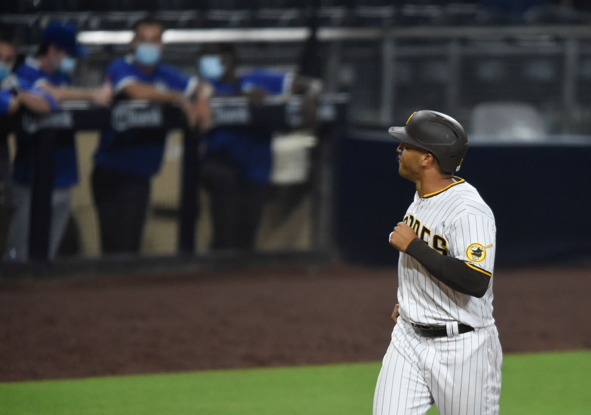 Padres outfielder Trent Grisham looks to the Dodgers dugout after hitting a solo home run during the sixth inning.