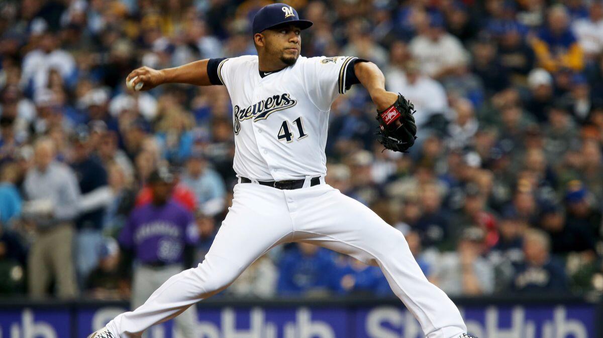 Milwaukee Brewers pitcher Junior Guerra pitches in the second inning against the Colorado Rockies on Sunday.