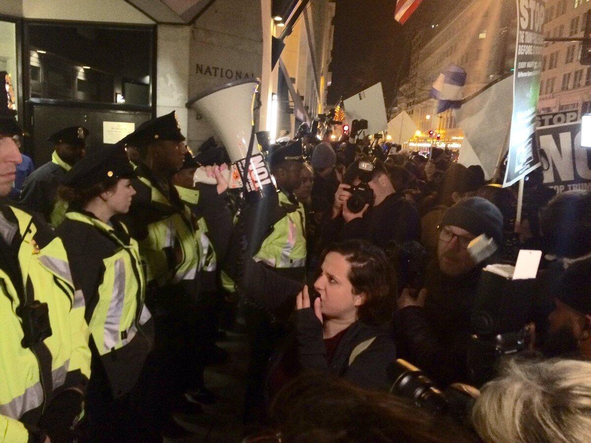 People protest a gathering at the National Press Club sponsored by white nationalist activists.