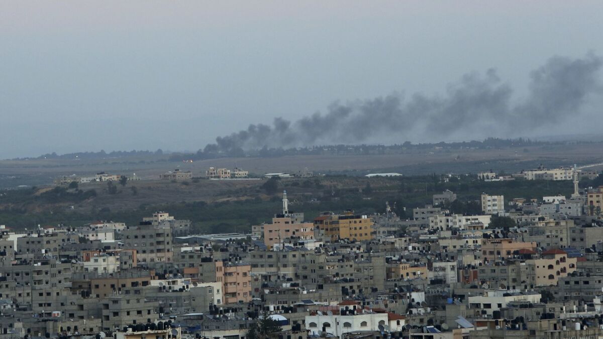 Smoke rises from a mortar attack on Israel by militants in Gaza City on Nov. 12, 2018.