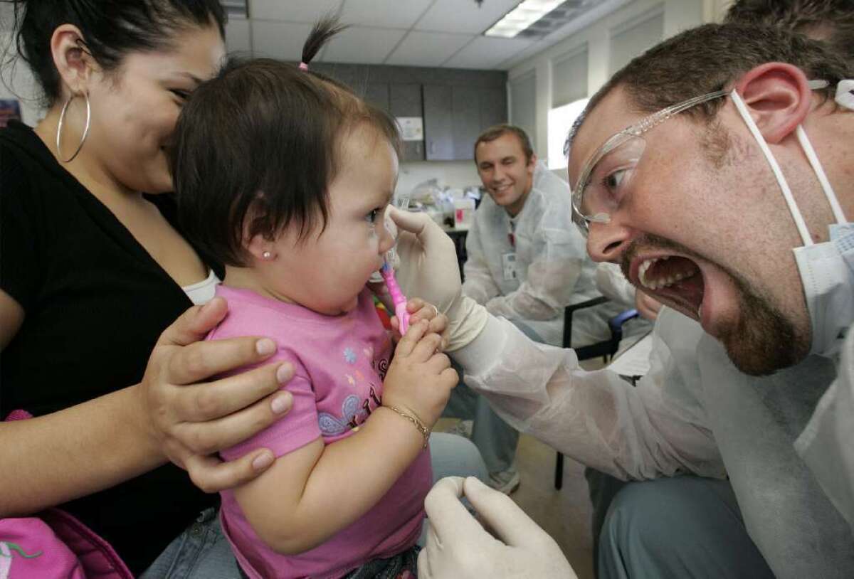 Covered California, which is implementing the federal health law in the state, endorsed its current approach to children's dental benefits for 2014 despite outside criticism.