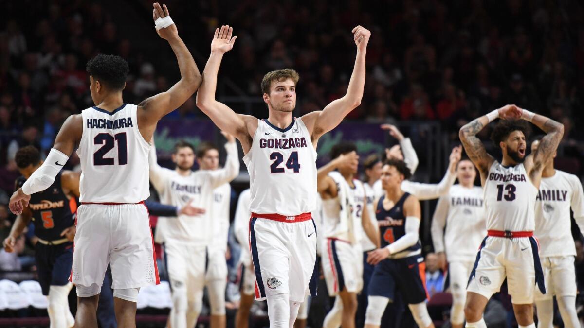 Gonzaga's Rui Hachimura, left, and Corey Kispert celebrate a victory over Pepperdine in the West Coast Conference tournament on March 11.