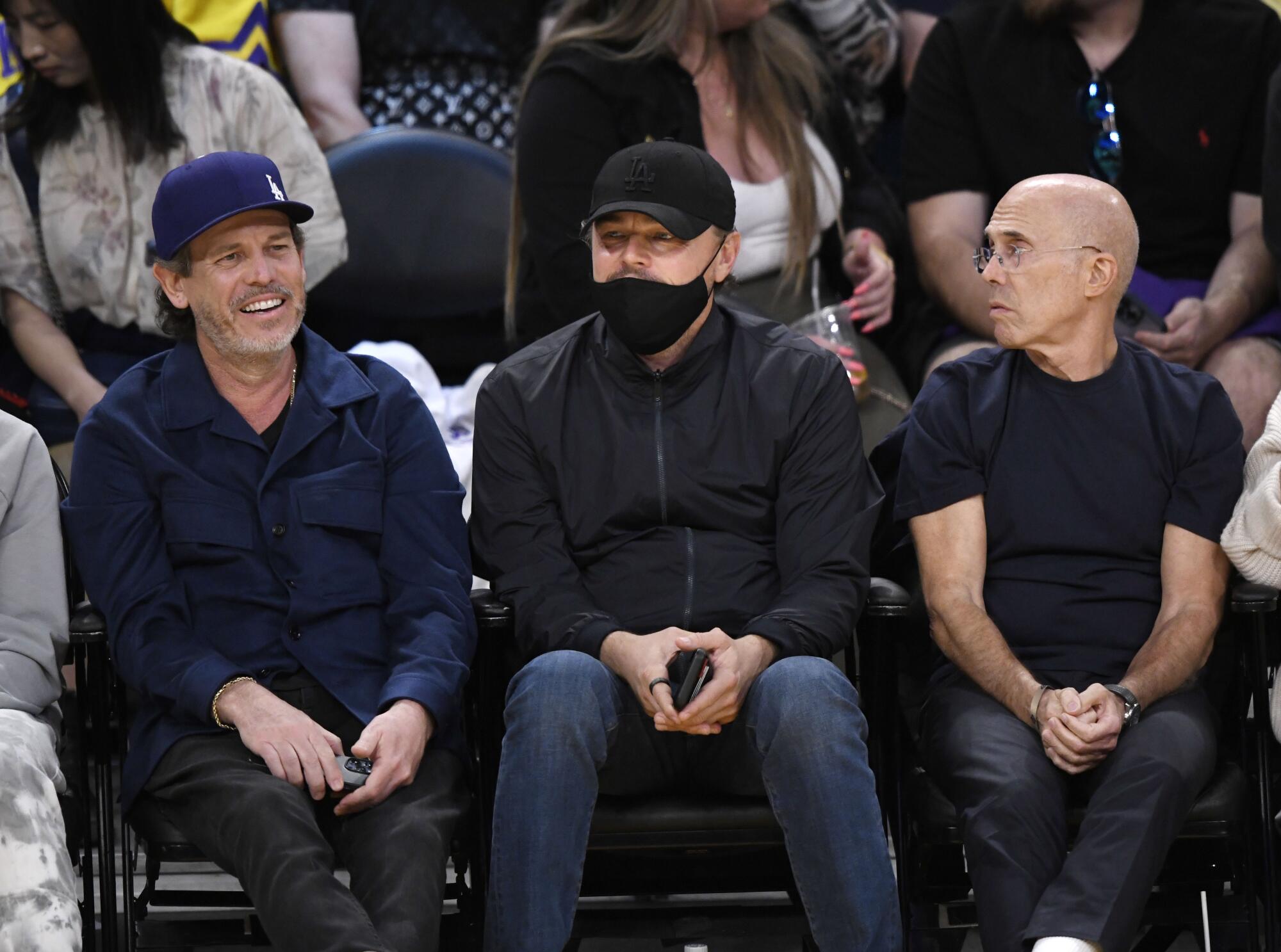 Leonardo DiCaprio, center, and Jeffrey Katzenberg, right.