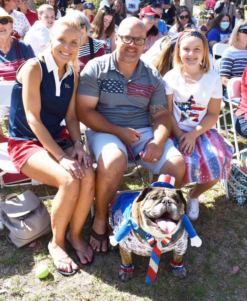 Bentley, an English bulldog, with owners Gabby, Chris and Audrey Bowder.