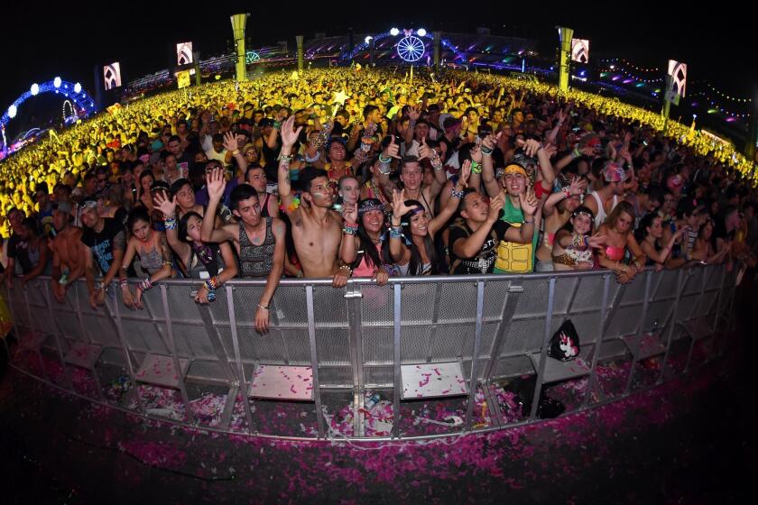 Fans react as Gareth Emery performs during the 18th annual Electric Daisy Carnival at Las Vegas Motor Speedway.