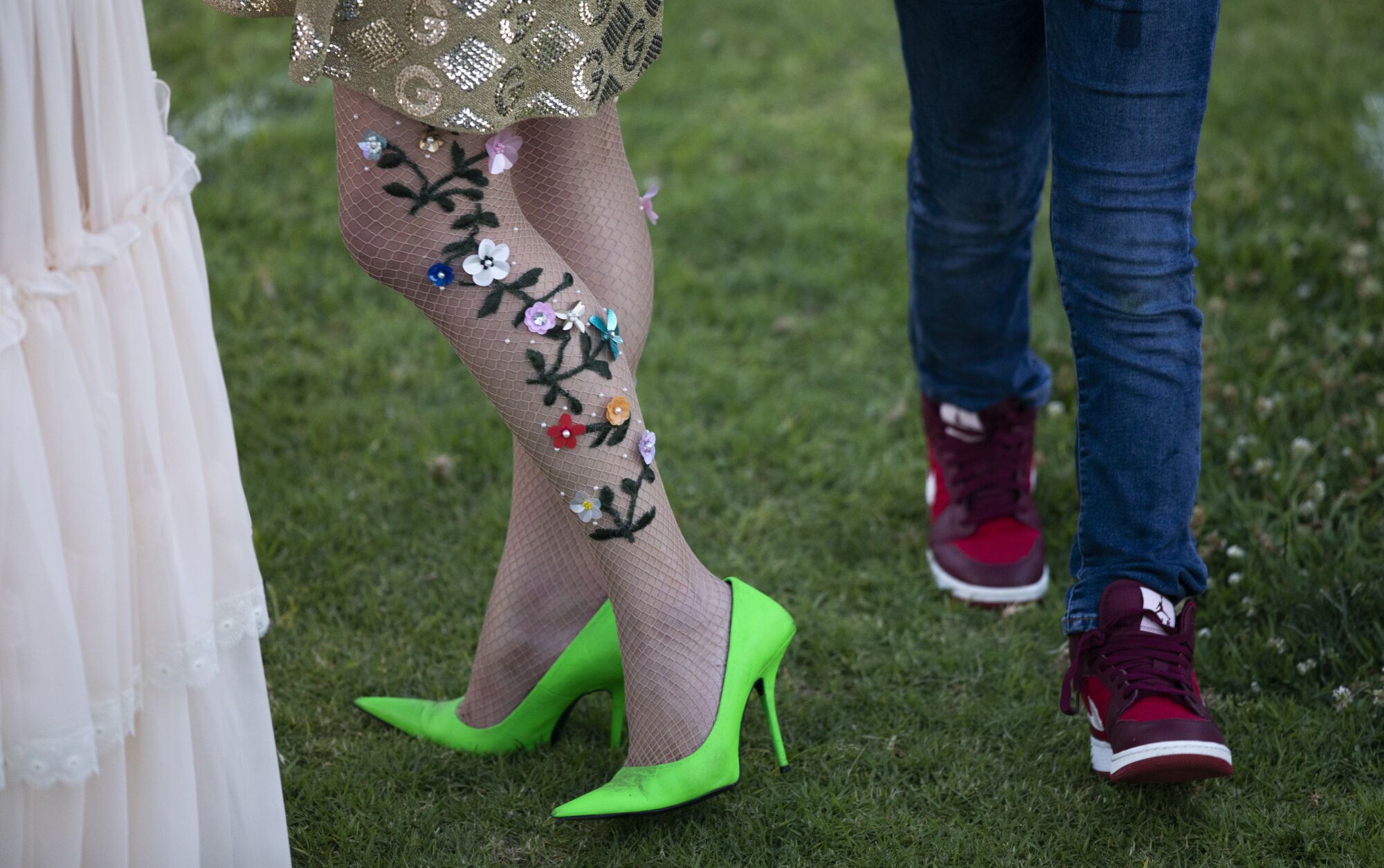 Decorated fishnets and lime heels fit right in alongside jeans and sneakers at the Rose Bowl. 