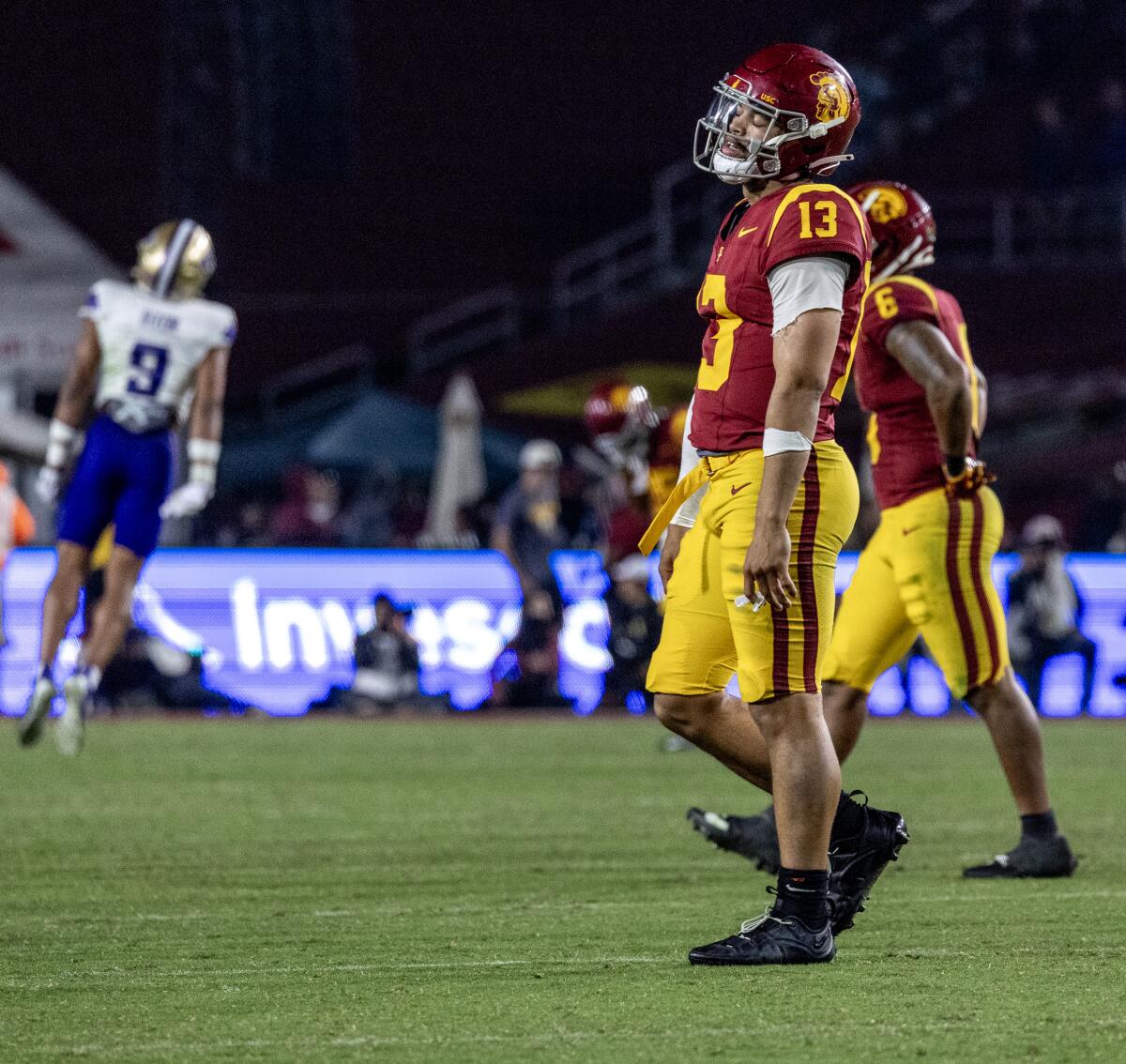 USC quarterback Caleb Williams walks off the field during the Trojans' loss to Washington at the Coliseum.