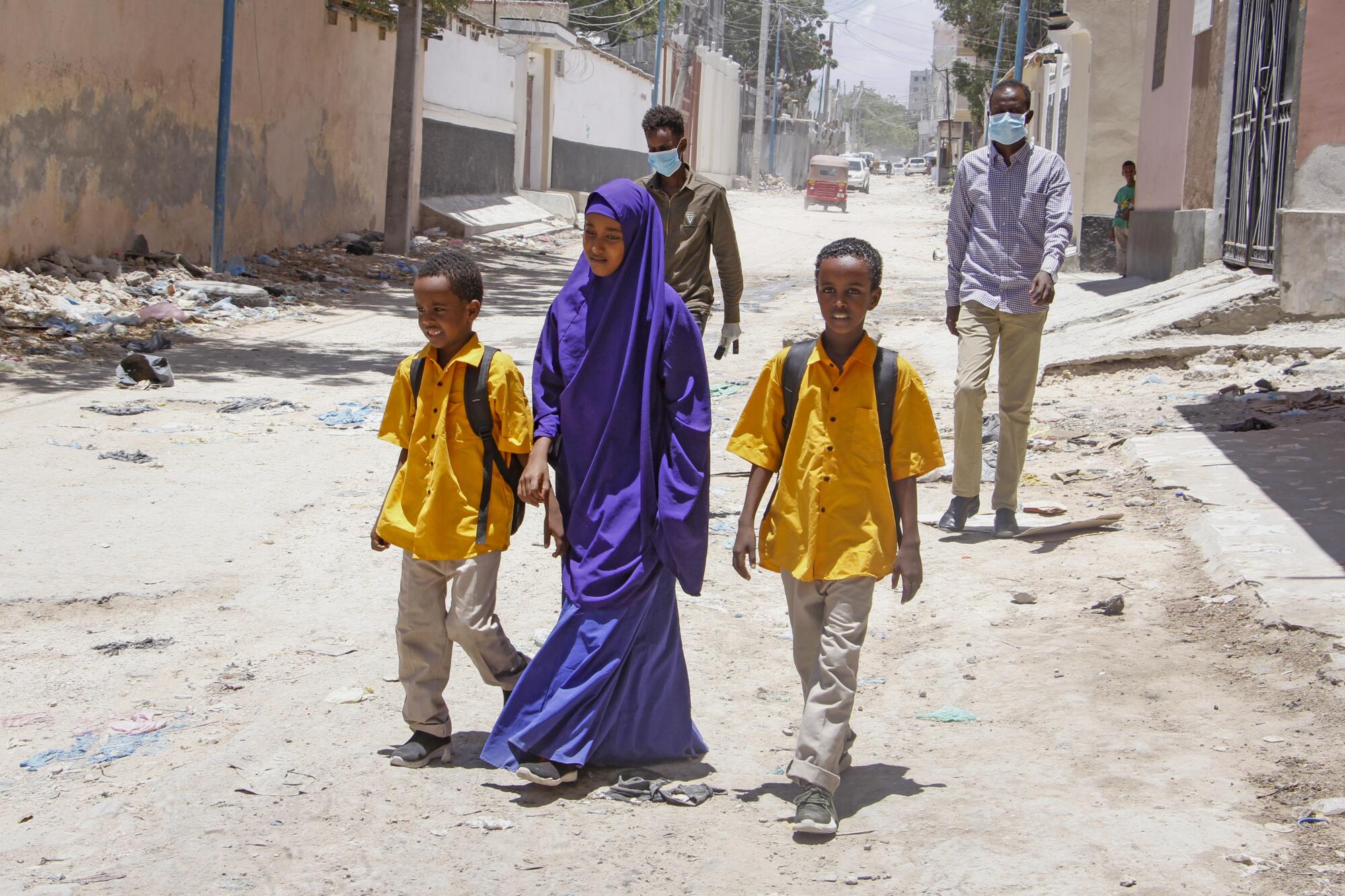 Children walk home in Mogadishu, Somalia, in March after the government announced the closure of schools.
