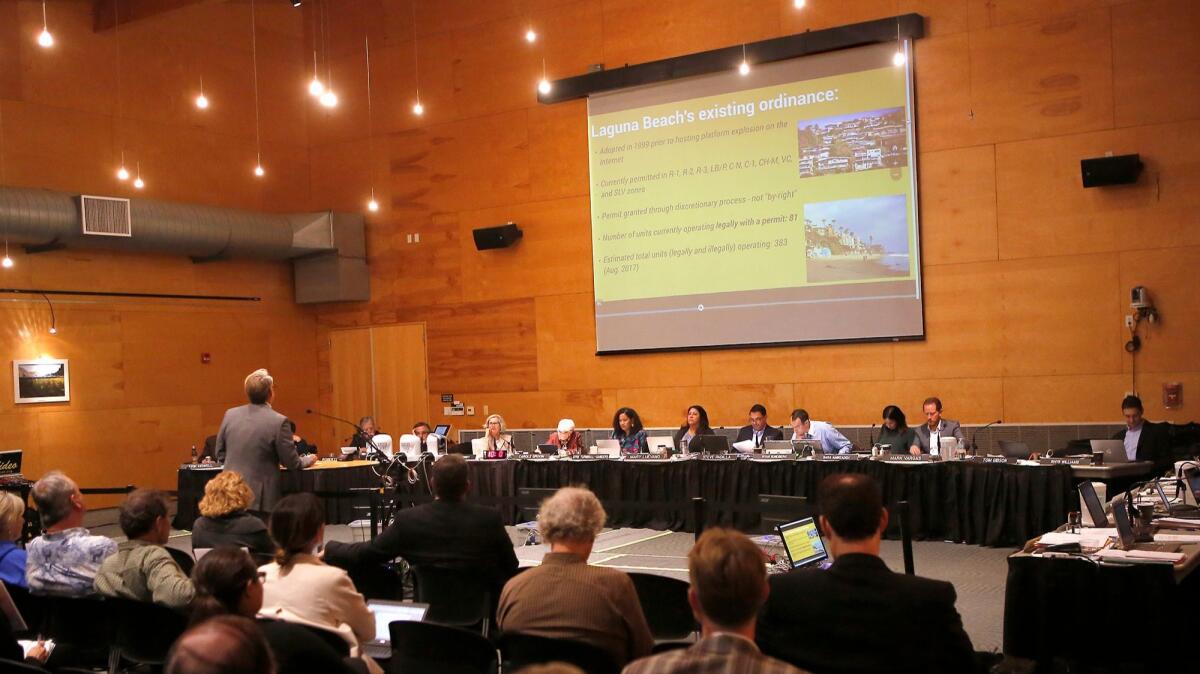 Laguna Beach Community Development Director Greg Pfost addresses the California Coastal Commission on Thursday at the Ocean Institute in Dana Point concerning the city’s proposal to ban new short-term lodging permits in residential areas.