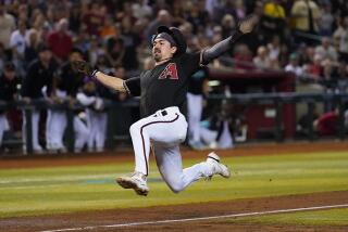 Arizona Diamondbacks' Corbin Carroll scores on a throwing error after stealing third.