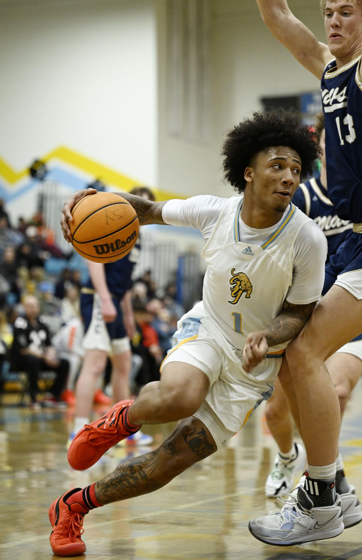 High school basketball: Mikey Williams comes to down