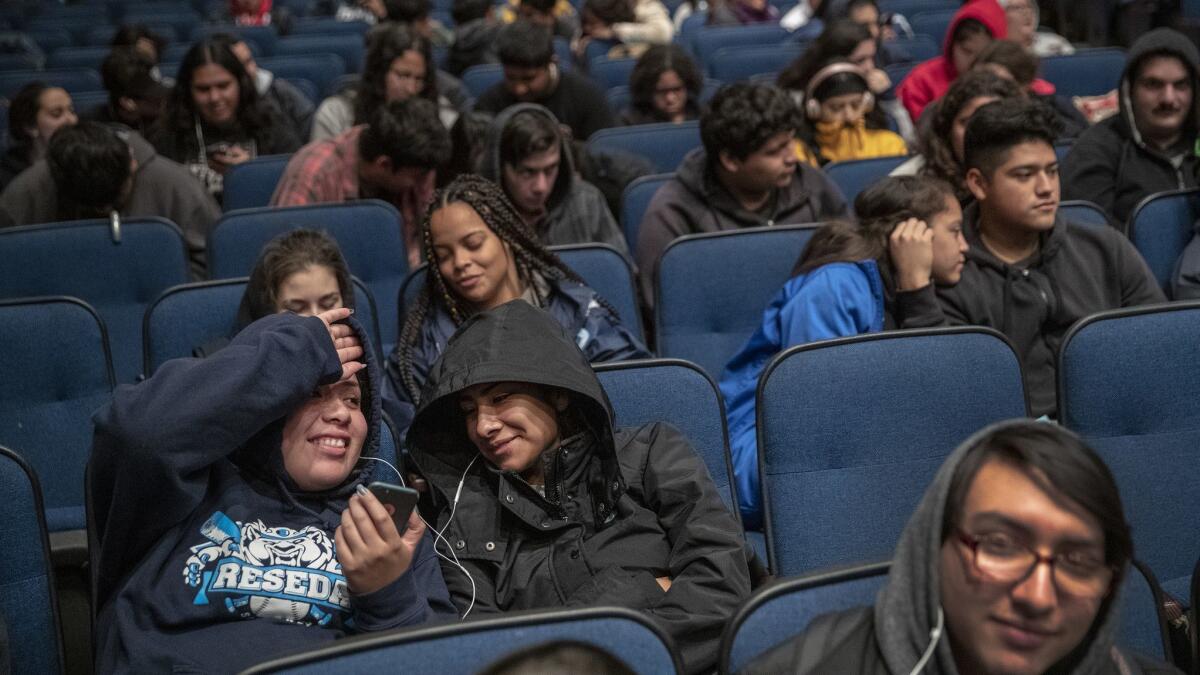 Reseda High students Guadalupe Gonzalez, 18, left, and friend Xiomara Garcia, 17, right, sit in the school auditorium as UTLA teachers are out on strike.
