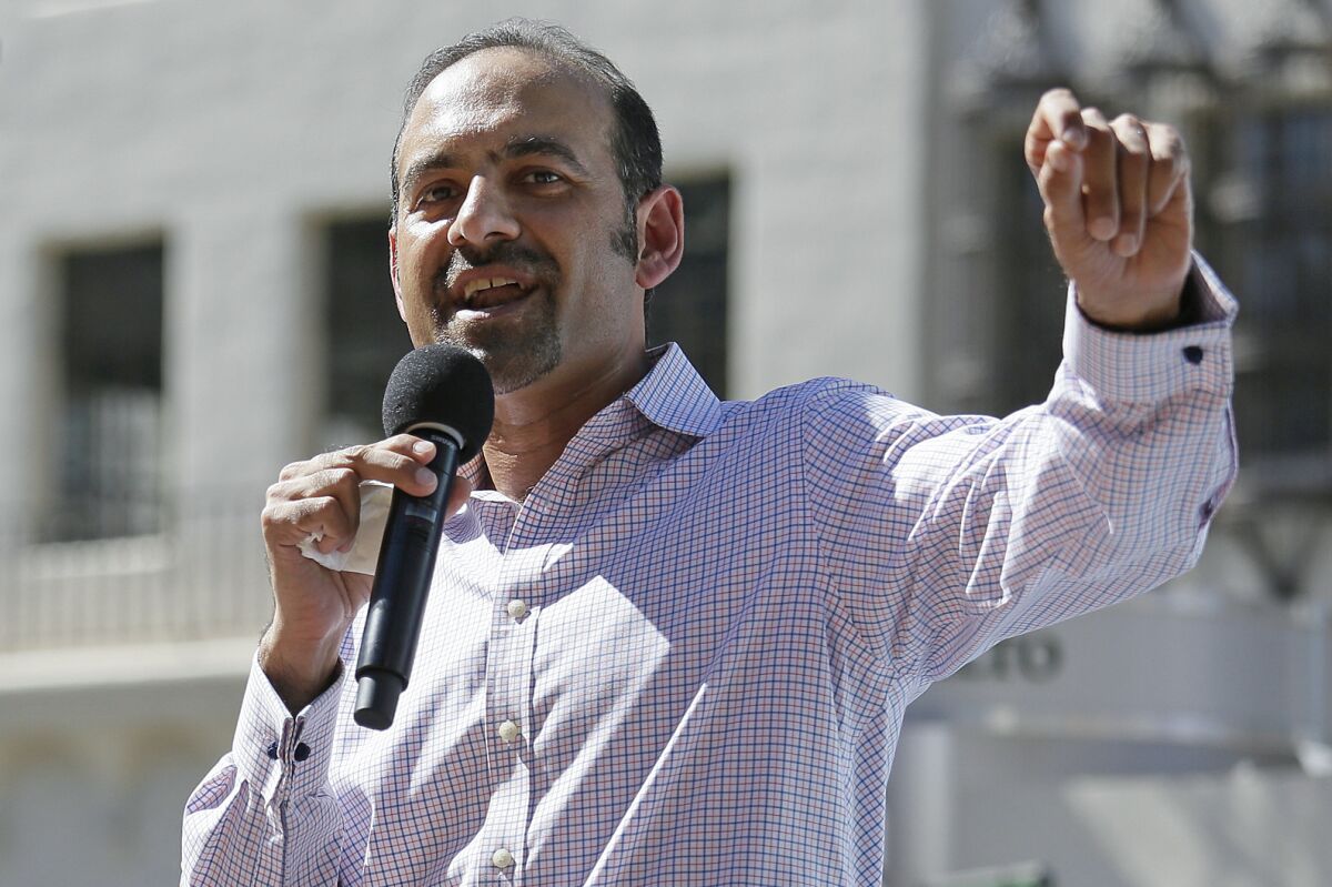 FILE - In this March 14, 2017, file photo Dilawar Syed, president of the software company Freshdesk, speaks during a Tech Stands Up rally outside City Hall in Palo Alto, Calif. If Syed is confirmed as deputy administrator of the Small Business Administration, he will be the highest-ranking Muslim in U.S. government. But his nomination is in peril as Senate Republicans block a committee vote, citing the agency's payouts to abortion providers — the latest in a series of objections to the Pakistani-born businessman's confirmation .(AP Photo/Eric Risberg, File)