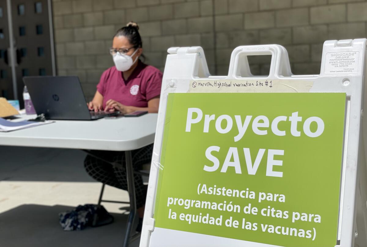 Sandra Mendoza provides assistance to the community outside the vaccination clinic at Mar Vista High School
