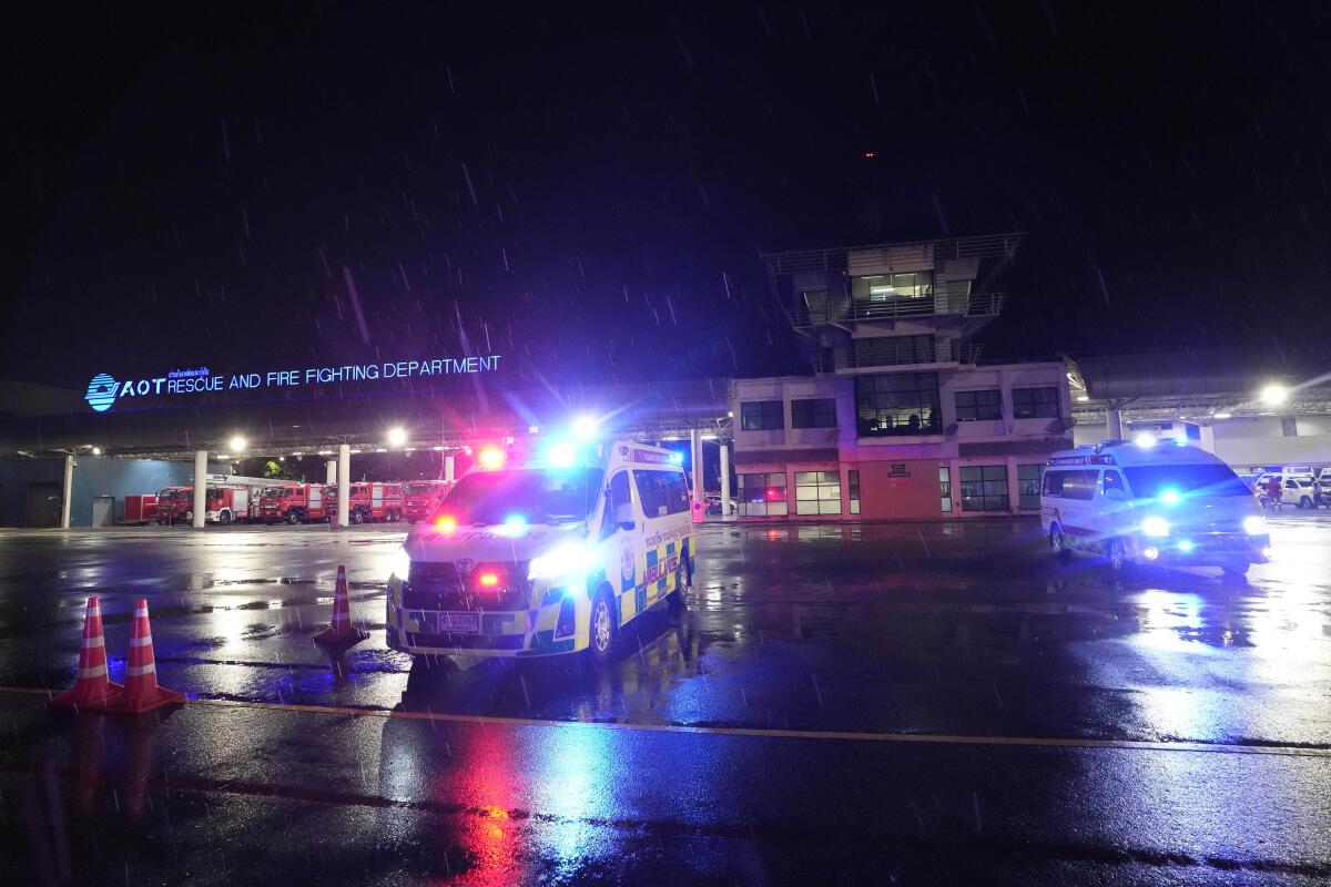 Ambulances are seen at an airport.